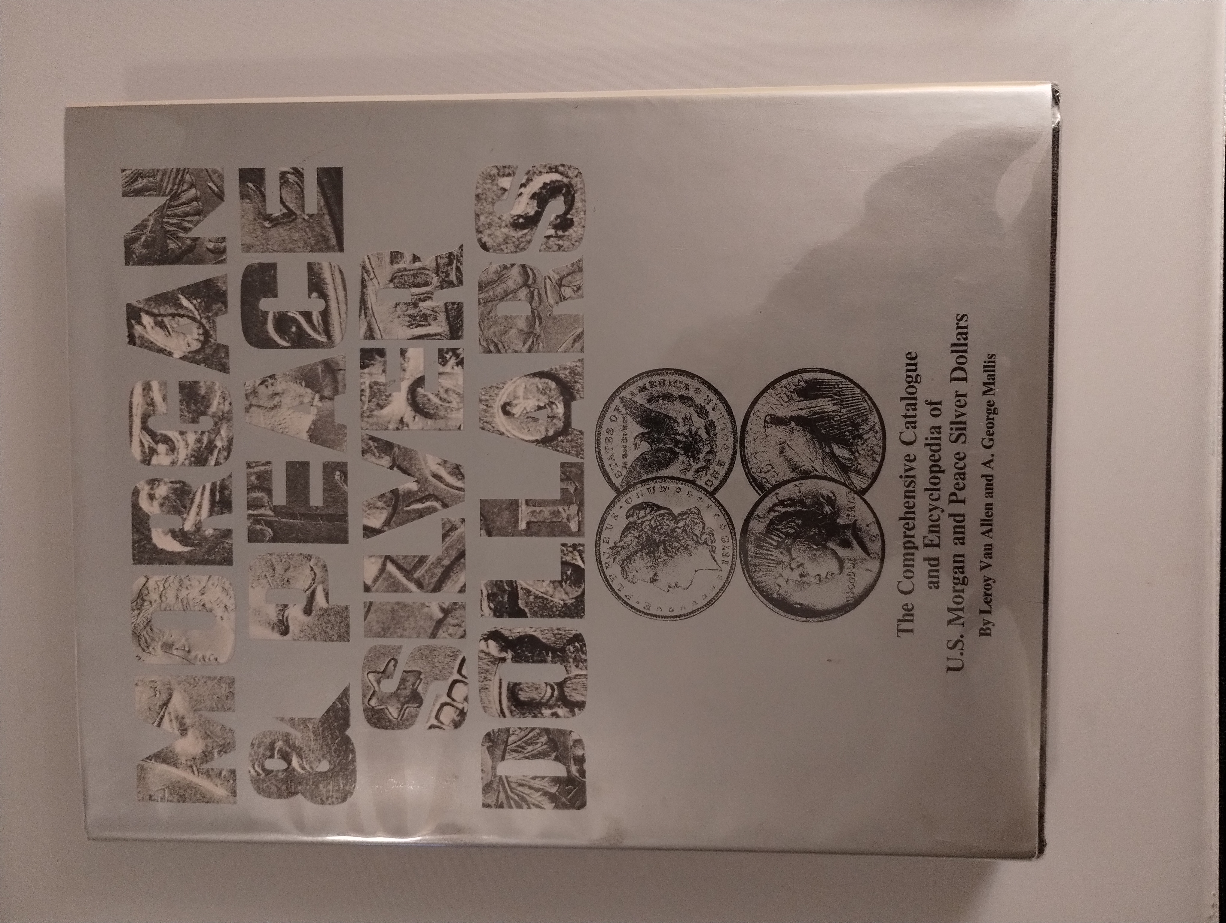 COMPREHENSIVE CATALOGUE AND ENCYCLOPEDIA OF U.S. MORGAN AND PEACE SILVER DOLLARS