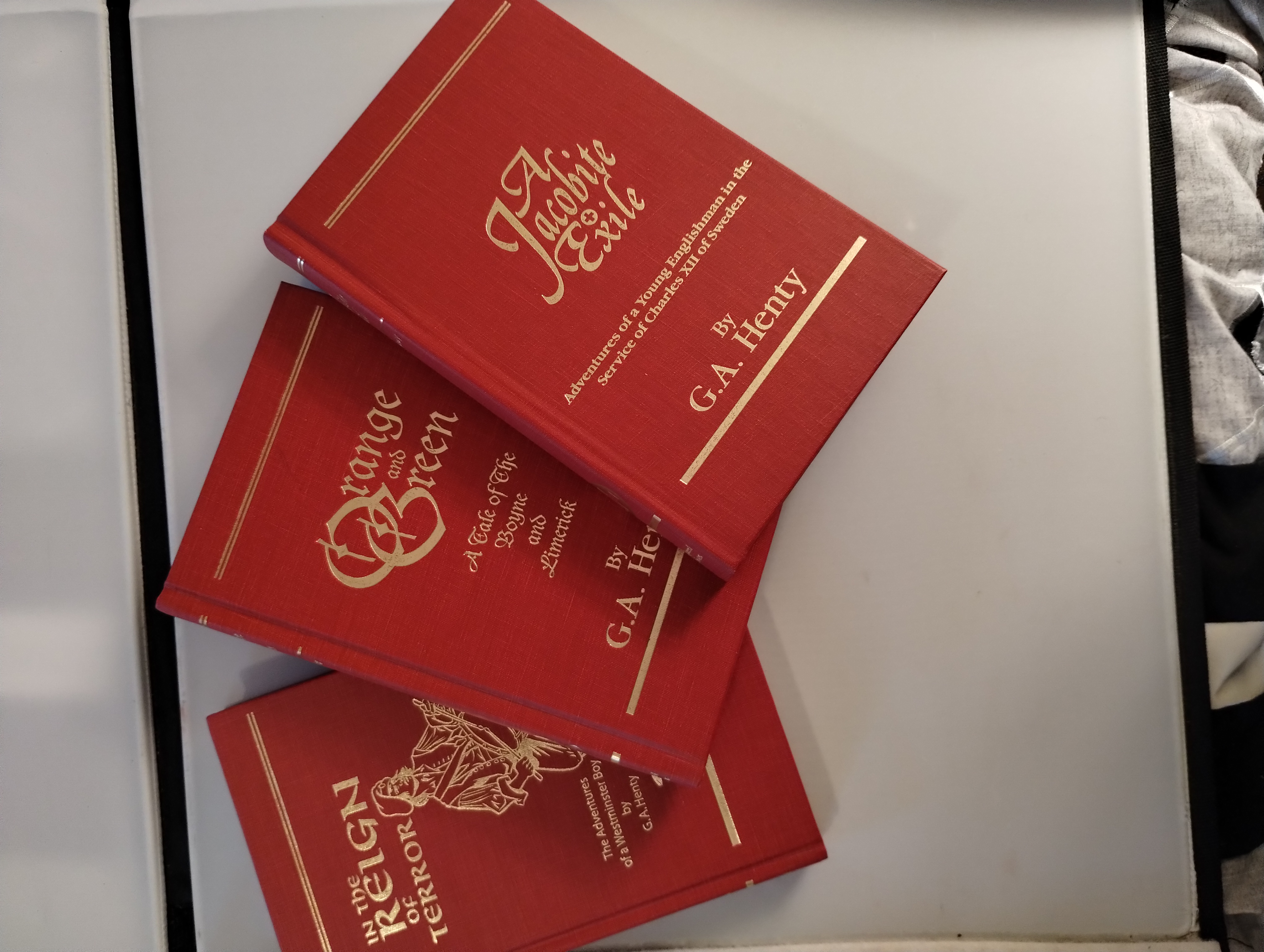 THEREE GA HENTY NOVELS , THE JACOBITE EXILE . IN THE REIGN OF TERROR , ORANG AND GREEN